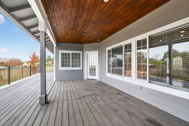 a view of outdoor space with wooden floor and window