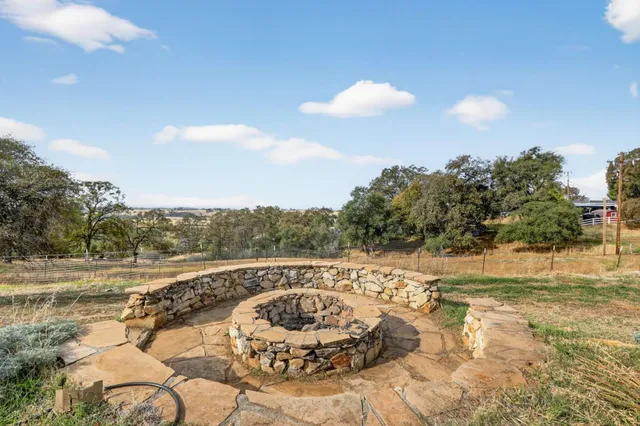 a view of a swimming pool and a yard