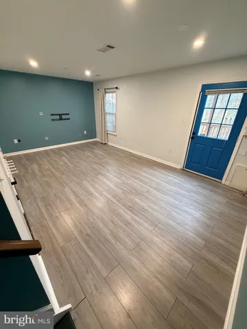 a big room with tall trees