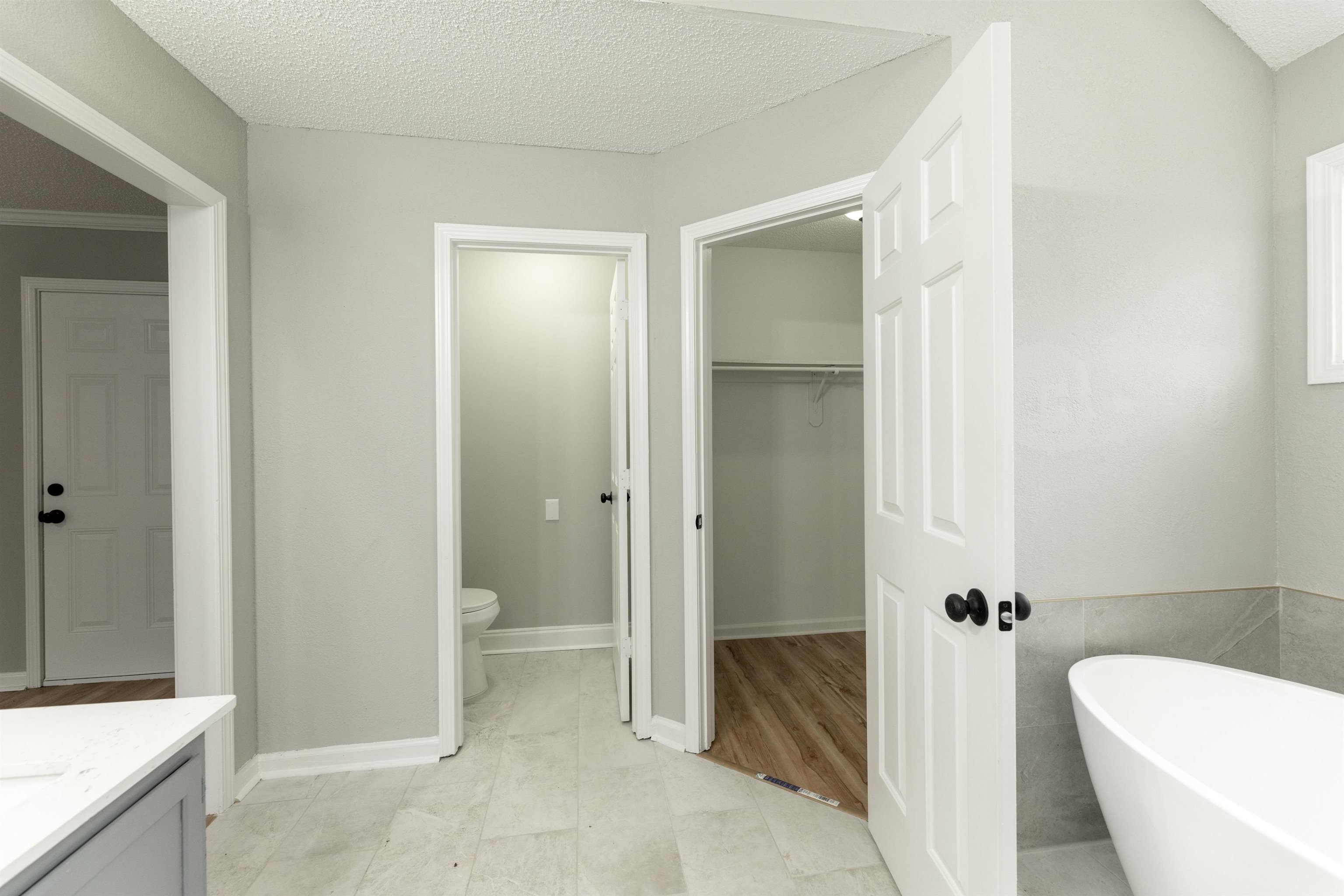 7421 Richmond Road Memphis, TN 38125 - Photo 28 of 39 Freestanding soaking tub with light grey tile surround