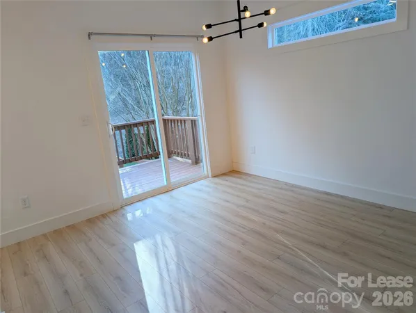 a view of entryway with wooden floor