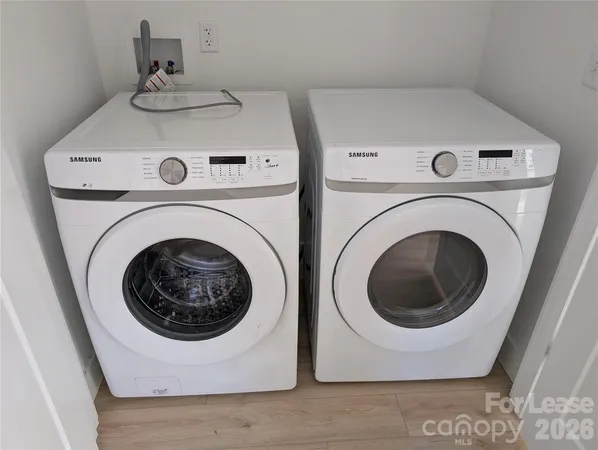 a utility room with dryer and washer
