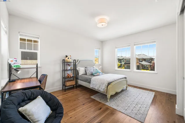 a bedroom with furniture and a window