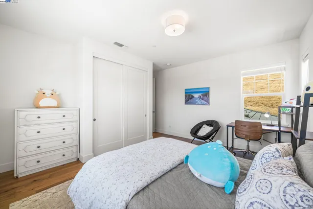 a bedroom with a bed and furniture