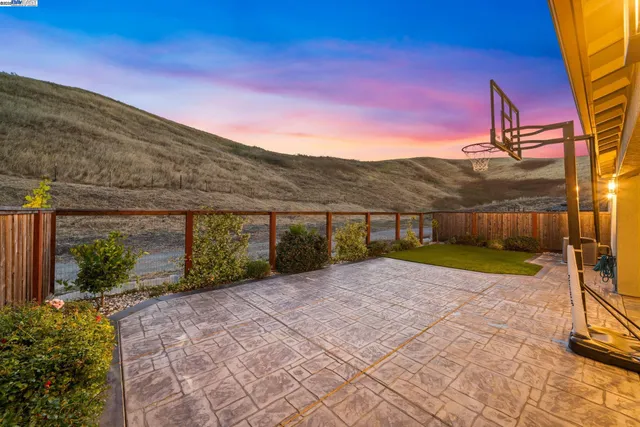 a view of a street with a building in the background