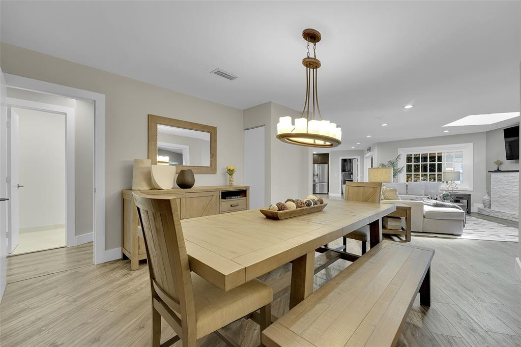5351 Godfrey Road Parkland, FL 33067 - Photo 13 of 100 a view of a dining room with furniture and wooden floor
