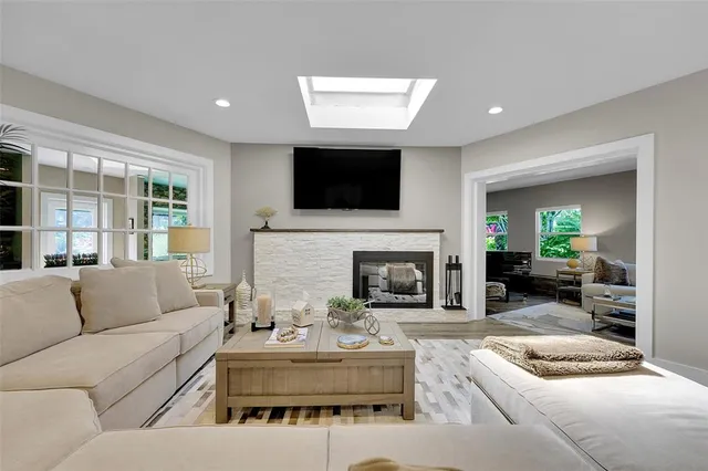 a kitchen with stainless steel appliances a refrigerator sink and stove
