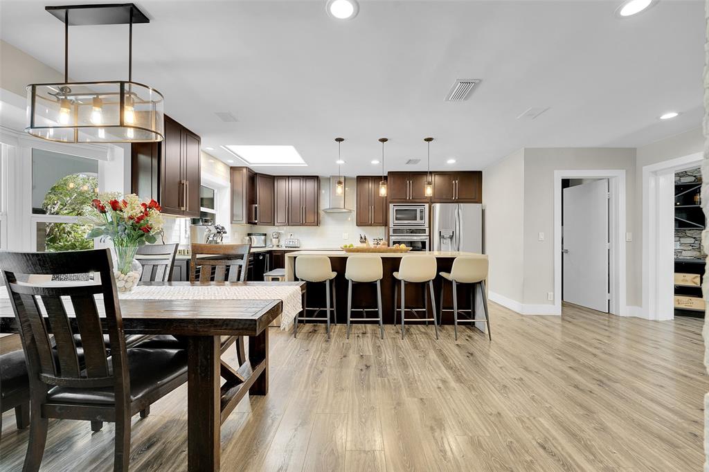5351 Godfrey Road Parkland, FL 33067 - Photo 17 of 100 a view of a dining room with furniture and wooden floor