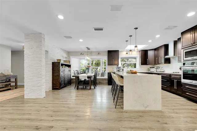 a living room with furniture a window and a fireplace