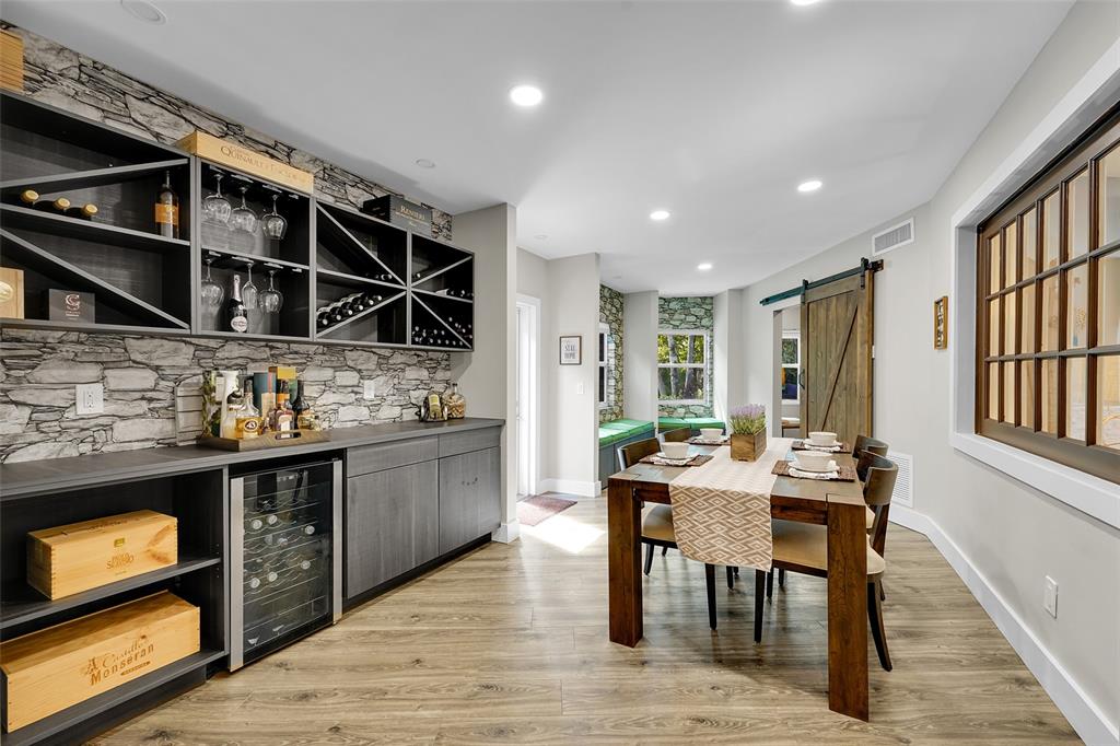 5351 Godfrey Road Parkland, FL 33067 - Photo 25 of 100 a open kitchen with stainless steel appliances granite countertop a stove and a wooden cabinets