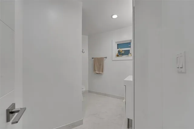 a bedroom with a bed and a table