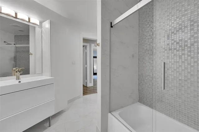 a bedroom with a bed and lamp