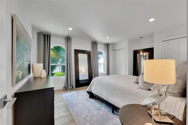 a bedroom with a bed and a desk