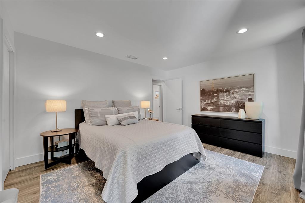 5351 Godfrey Road Parkland, FL 33067 - Photo 37 of 100 a bedroom with a bed and a painting on the wall