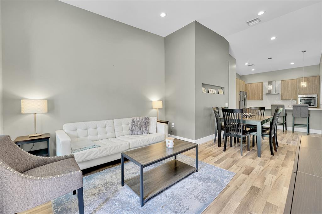 5351 Godfrey Road Parkland, FL 33067 - Photo 52 of 100 a living room with furniture a dining table and a potted plant