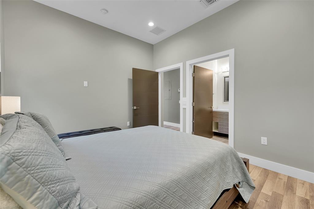5351 Godfrey Road Parkland, FL 33067 - Photo 57 of 100 a spacious bedroom with a bed and a mirror