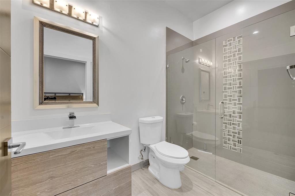 5351 Godfrey Road Parkland, FL 33067 - Photo 58 of 100 a bathroom with a sink a toilet and shower