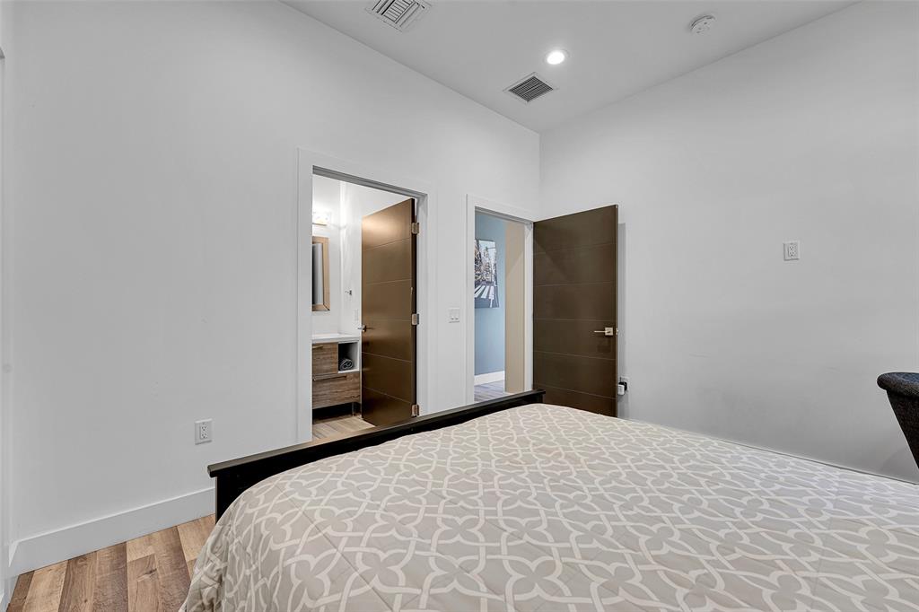 5351 Godfrey Road Parkland, FL 33067 - Photo 67 of 100 a bedroom with a bed and lamp