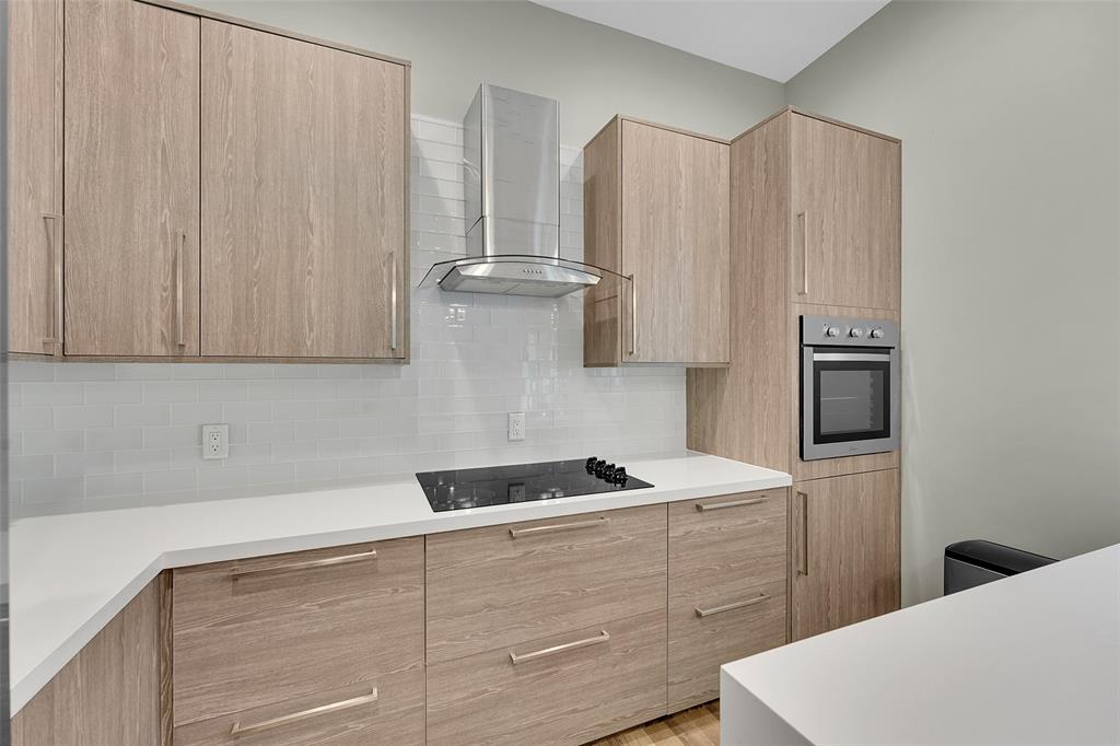 5351 Godfrey Road Parkland, FL 33067 - Photo 76 of 100 a kitchen with appliances a sink and cabinets