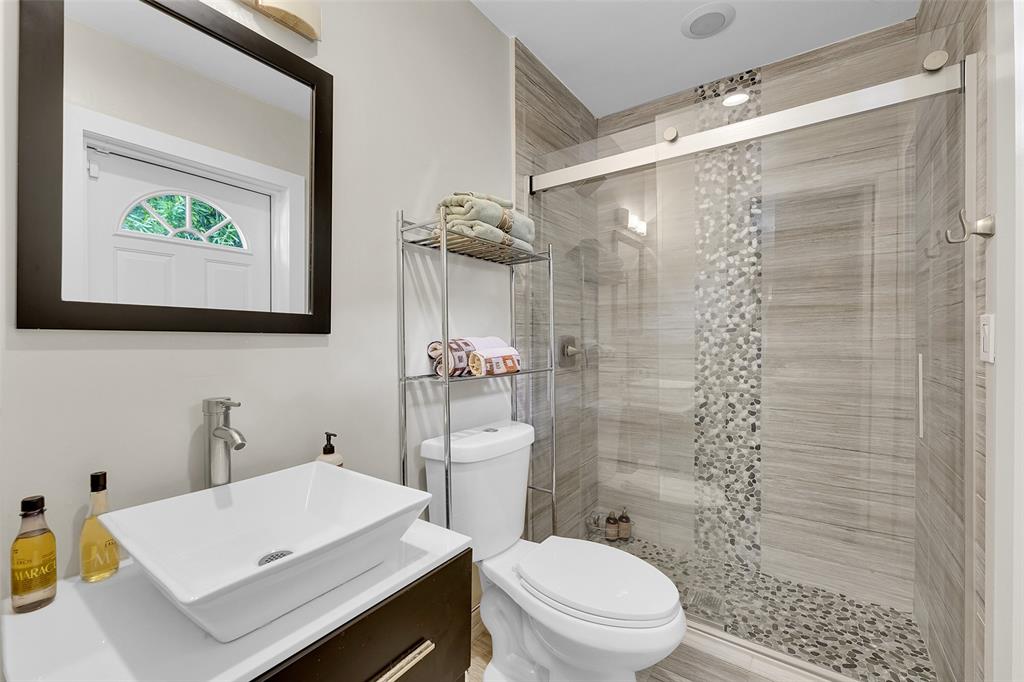 5351 Godfrey Road Parkland, FL 33067 - Photo 77 of 100 a bathroom with a sink a toilet and shower