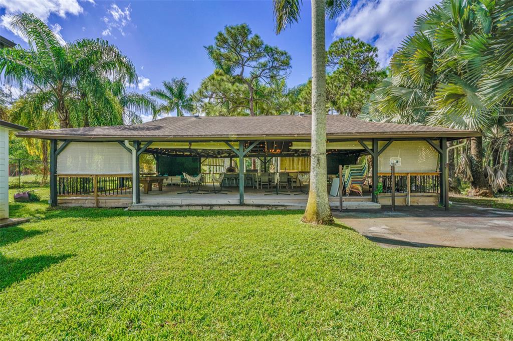 5351 Godfrey Road Parkland, FL 33067 - Photo 81 of 100 swimming pool view with a garden space