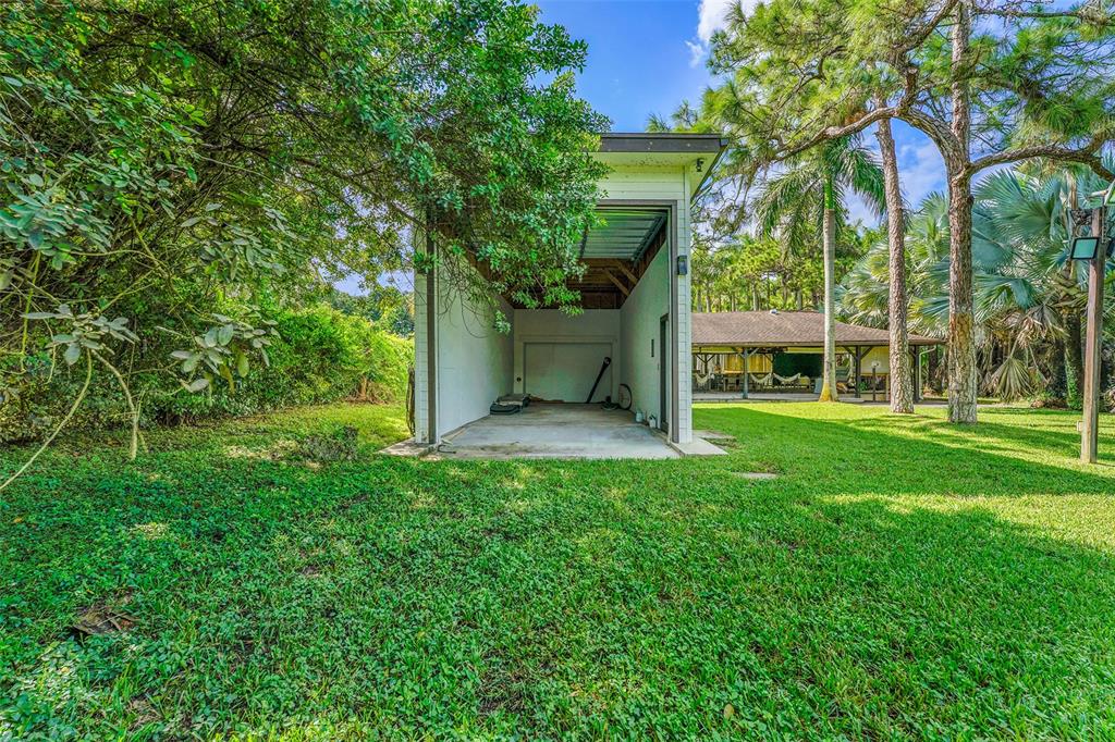 5351 Godfrey Road Parkland, FL 33067 - Photo 88 of 100 a view of a house with a yard