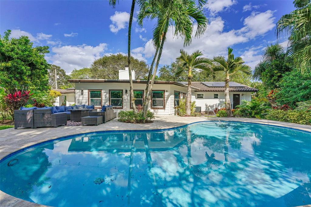 5351 Godfrey Road Parkland, FL 33067 - Photo 92 of 100 a view of a house with swimming pool and sitting area