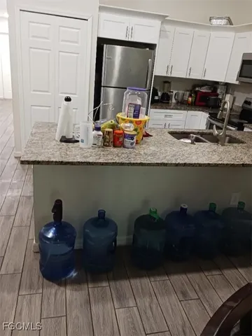 a kitchen with a sink and cabinets