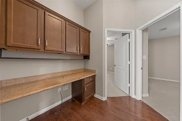 a view of cabinets with wooden floor