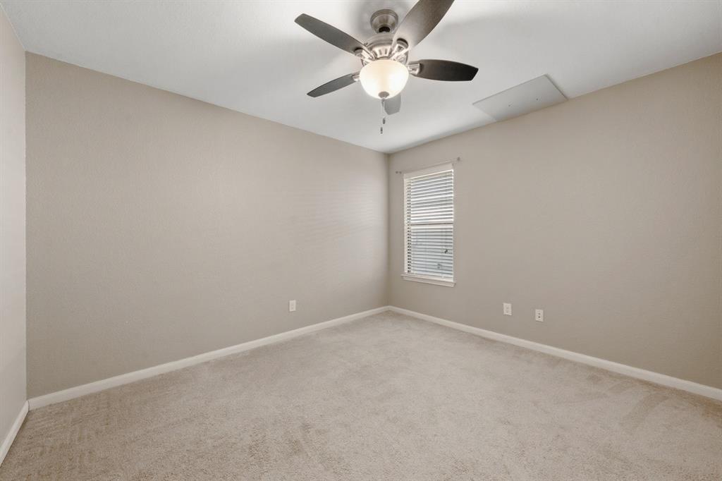 10445 Condor Loop Waco, TX 76708 - Photo 14 of 22 an empty room with a window and a fan