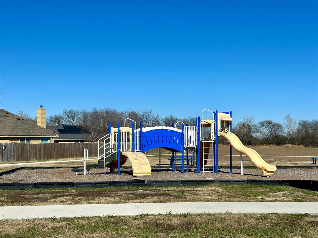 10445 Condor Loop Waco, TX 76708 - Photo 22 of 22 a view of a swimming pool with a chair and the trees