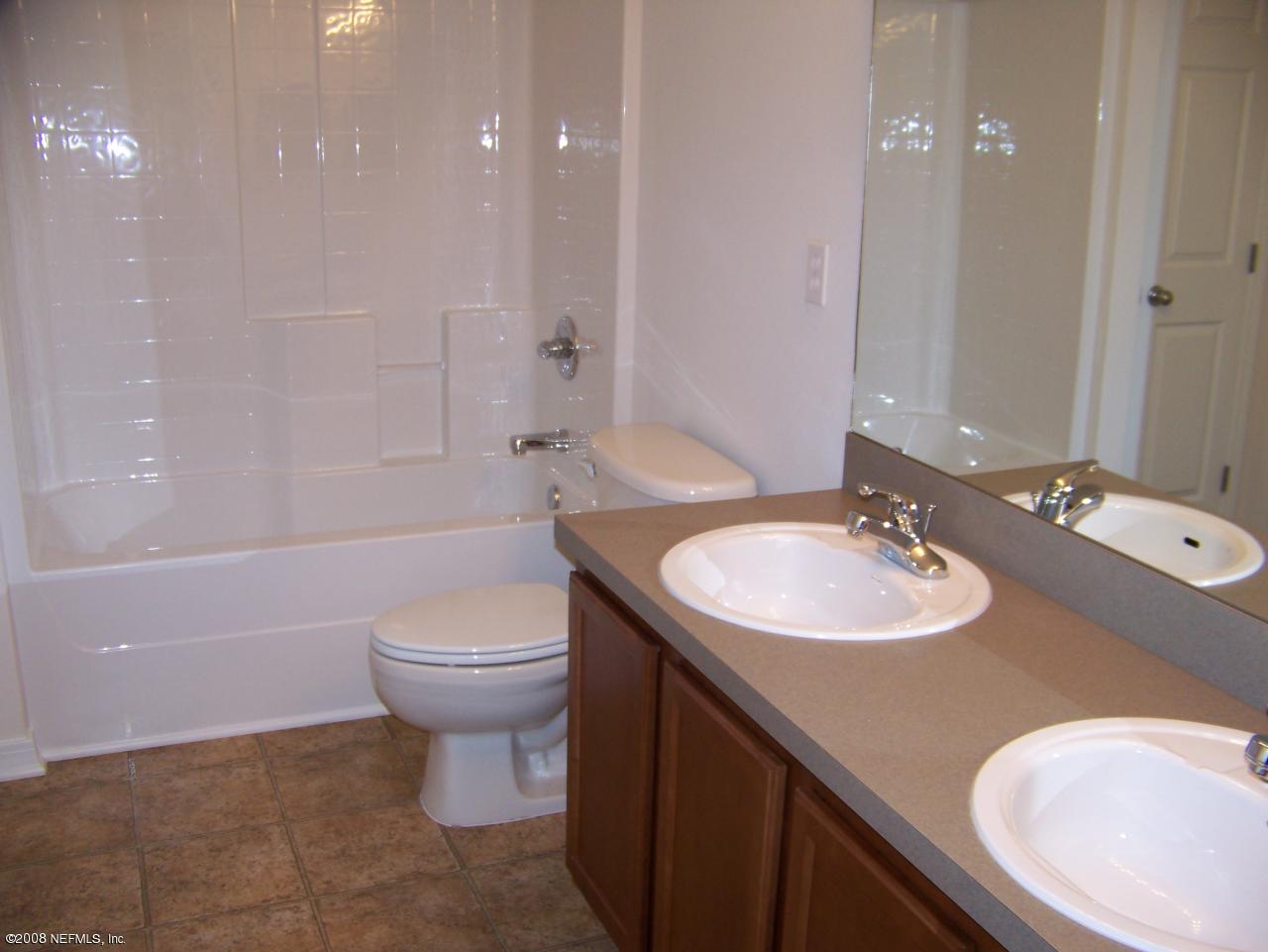 3056 Longleaf Ranch Circle Middleburg, FL 32068 - Photo 5 of 8 bathroom leading to porch
