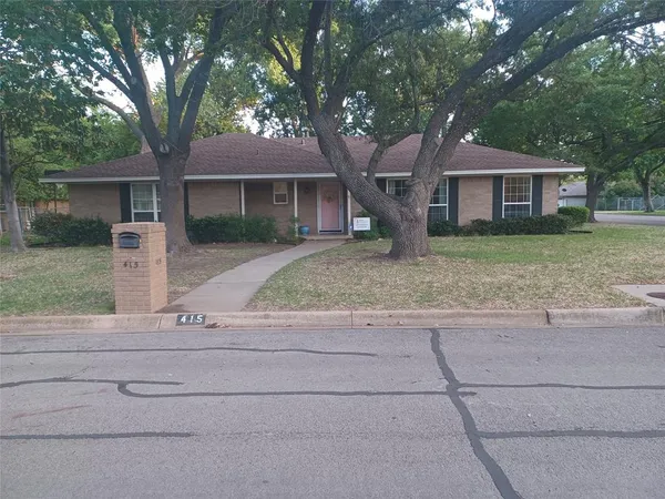 a front view of a house with yard