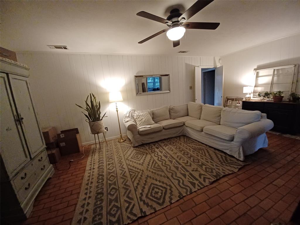 415 Magnolia Street Denton, TX 76201 - Photo 11 of 23 a living room with furniture and a wooden floor