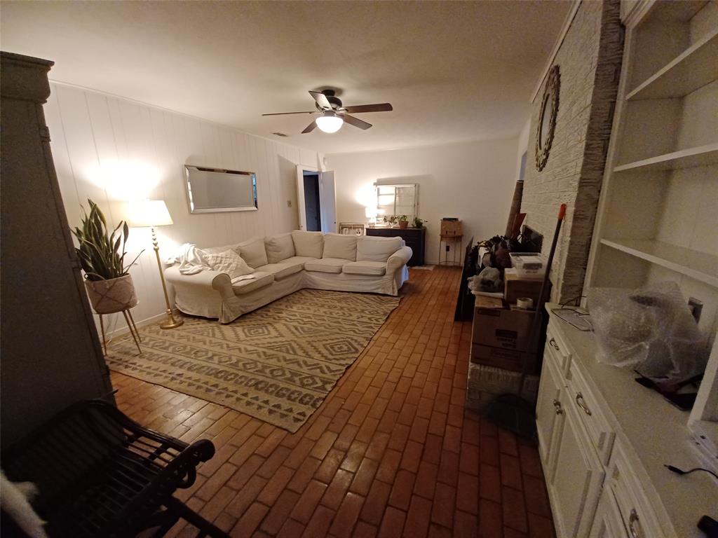 415 Magnolia Street Denton, TX 76201 - Photo 12 of 23 a living room with furniture and a fireplace