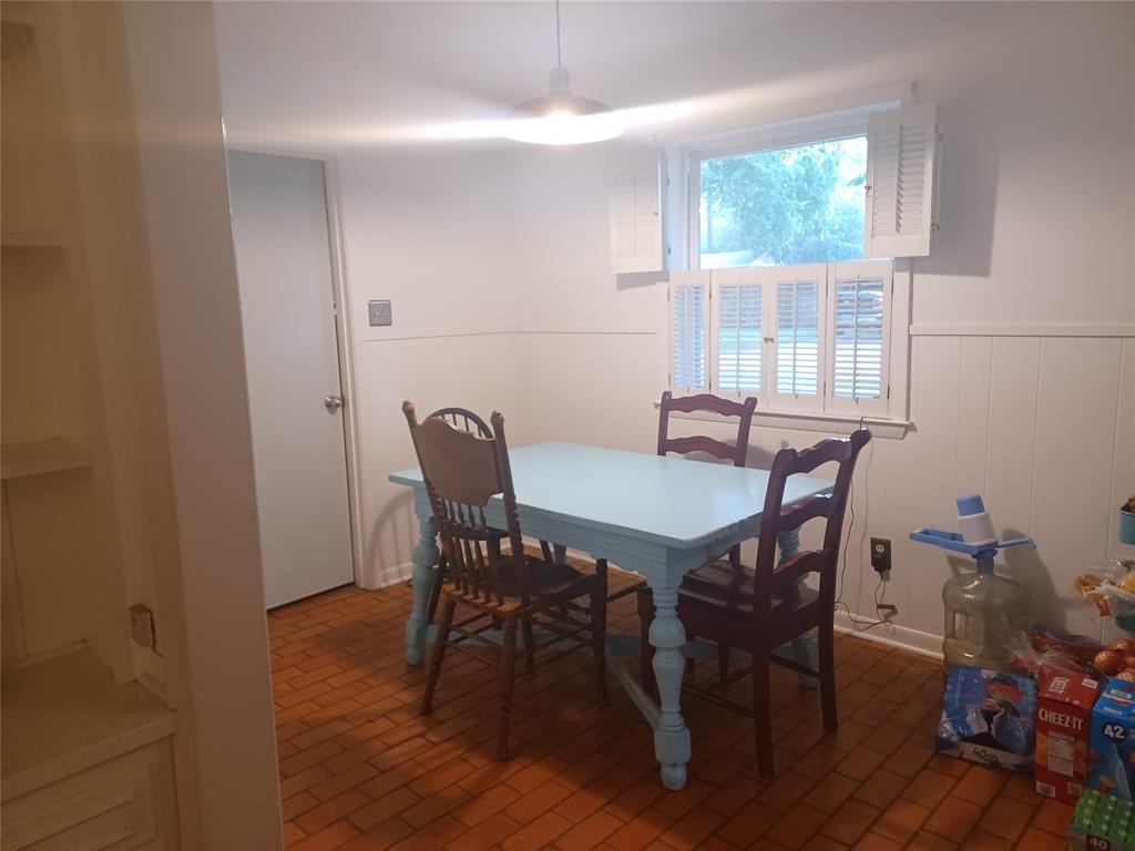 415 Magnolia Street Denton, TX 76201 - Photo 14 of 23 a view of a dining room with furniture and wooden floor