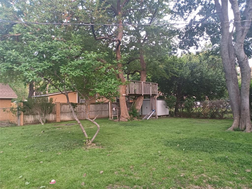 415 Magnolia Street Denton, TX 76201 - Photo 19 of 23 a view of a house with a yard and tree s