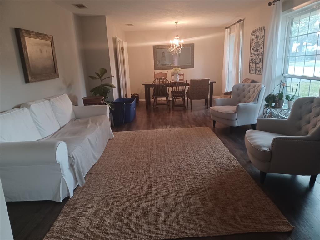 415 Magnolia Street Denton, TX 76201 - Photo 3 of 23 a living room with furniture wooden floor and window