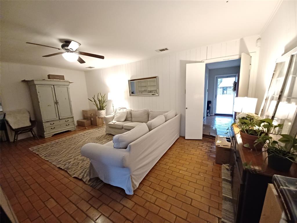 415 Magnolia Street Denton, TX 76201 - Photo 7 of 23 a living room with furniture and a chandelier