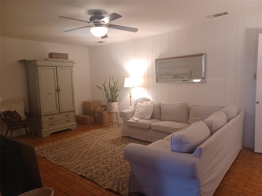 415 Magnolia Street Denton, TX 76201 - Photo 8 of 23 a living room with furniture and a chandelier