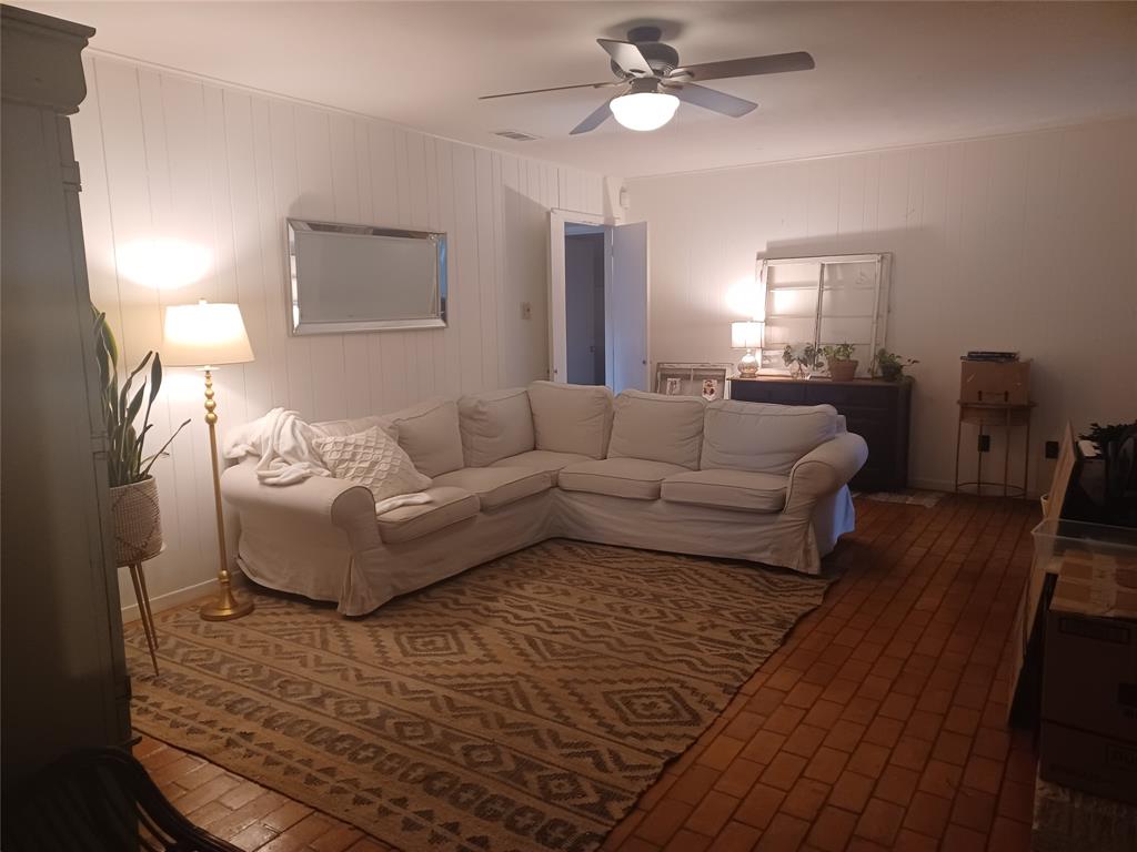 415 Magnolia Street Denton, TX 76201 - Photo 9 of 23 a living room with furniture and a wooden floor