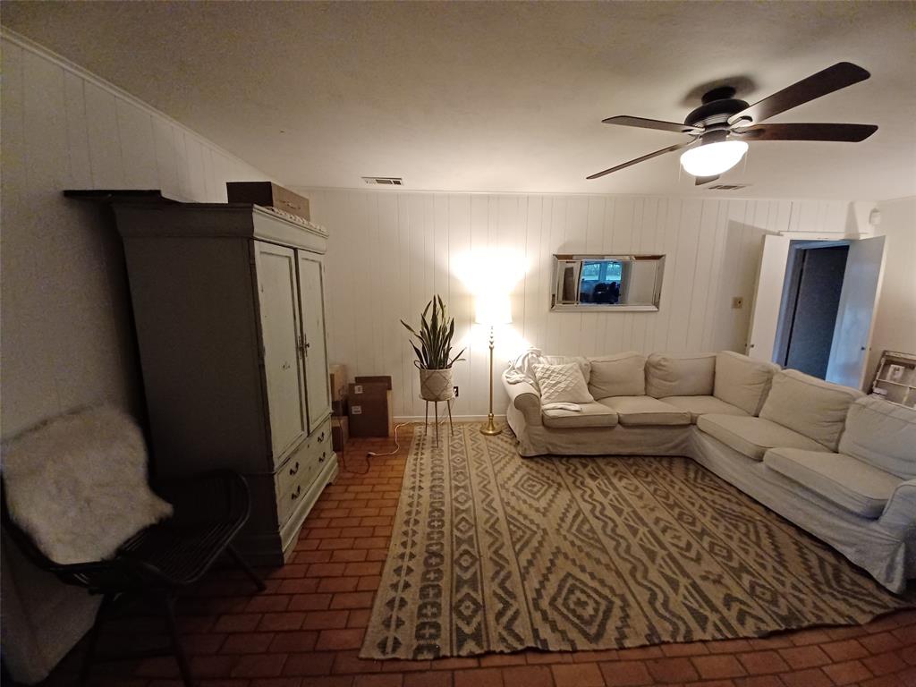 415 Magnolia Street Denton, TX 76201 - Photo 10 of 23 a living room with furniture and a rug