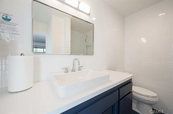 a bedroom with a large bed and a large window