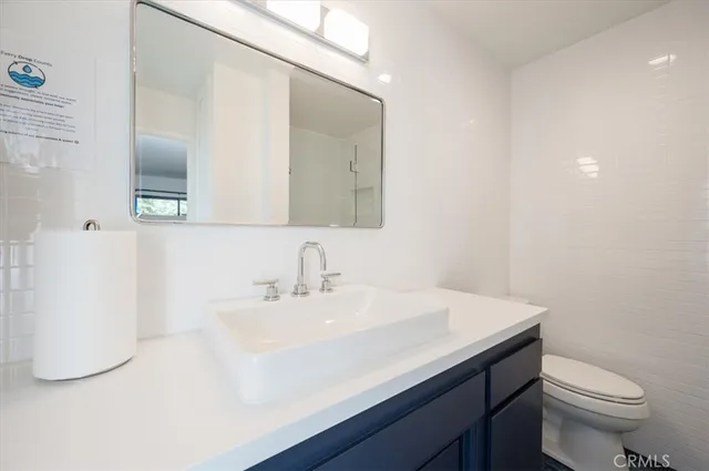 a bedroom with a large bed and a large window