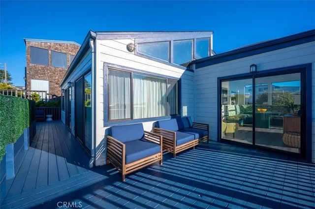 a view of a big yard with plants and large trees