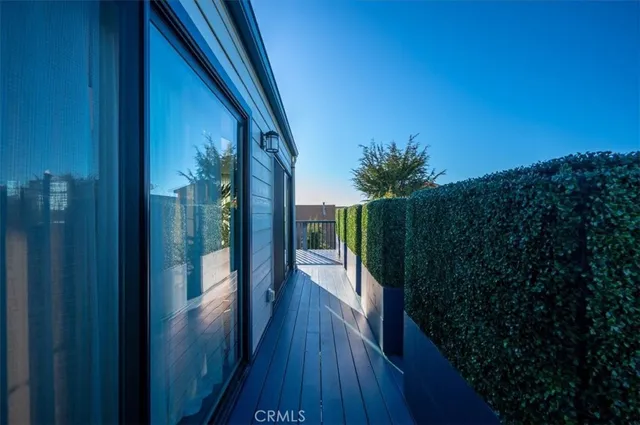 a view of a wooden door and a yard