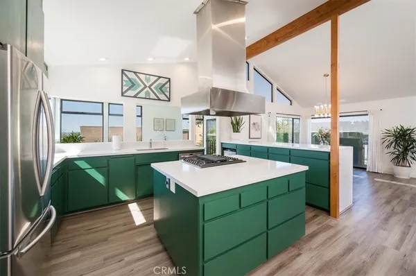 a kitchen with a sink and a large window