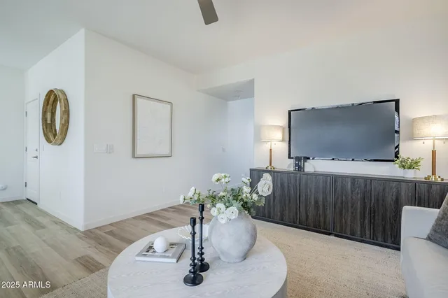a view of a dining room with furniture and wooden floor