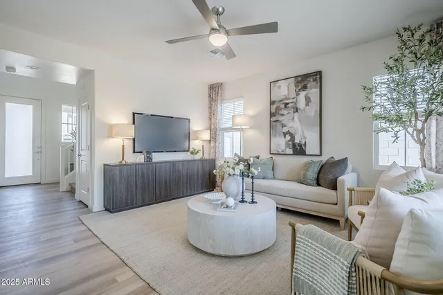 a view of a dining room with furniture and a potted plant