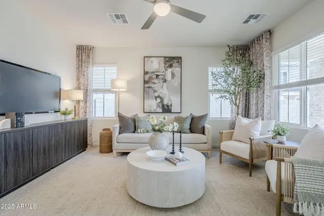 a dining room with furniture and a mirror